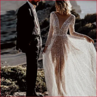 White Boho Lace Sheer Backless Sequined A-Line Wedding Dress with long sleeves and sparkle