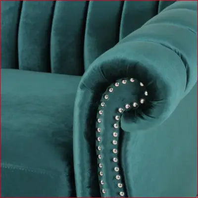 Emerald green velvet armchair with nailhead trim beside Bowie 84 In. Flared Arm Sofa