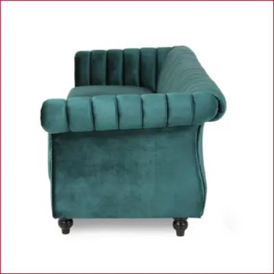 Green velvet channel-tufted sofa features flared arm and nailhead trim in Bowie collection