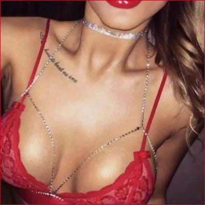 Red lace bra with rhinestone chain detailing for breast cleavage contour enhancement