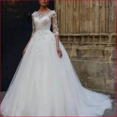 Elegant White Wedding Gown with Elbow Length Sleeves and Full Tulle Skirt