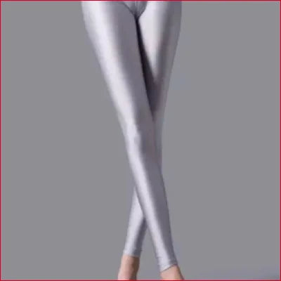 Shiny silver camel toe spandex leggings displayed on crossed legs in various sizes