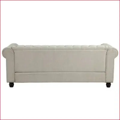 Chesterfield couches featuring a tufted light-colored sofa with scrolled arms and button-tufting