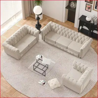 Tufted beige living room set featuring Chesterfield couches with scrolled arms and button-tufted accenting