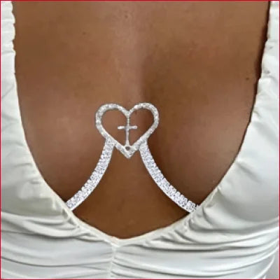 Heart Cross Crystal Rhinestone bra strap connector on dark skin with white fabric backdrop