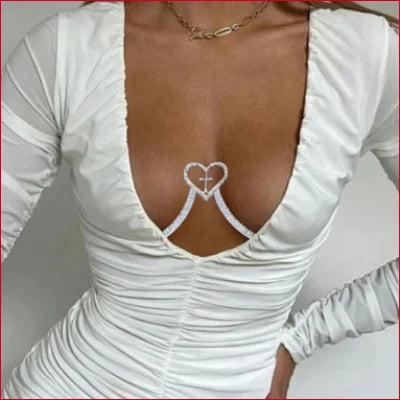 Elegant white ruched dress with plunging neckline, styled with Heart Cross Crystal Rhinestone Jewelry