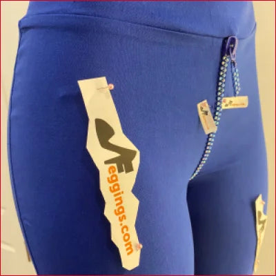 Blue Crystal Crotch Zipper Leggings with surfboard tag and zipper detail