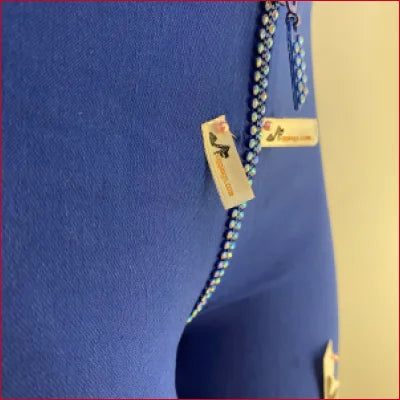 Blue handbag with decorative zipper pulls, perfect for pairing with Crystal Crotch Zipper leggings