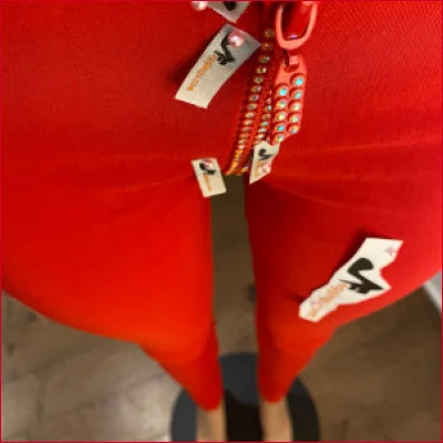 Red jacket with partially open zipper highlighting Crotch Zipper Red Leggings design