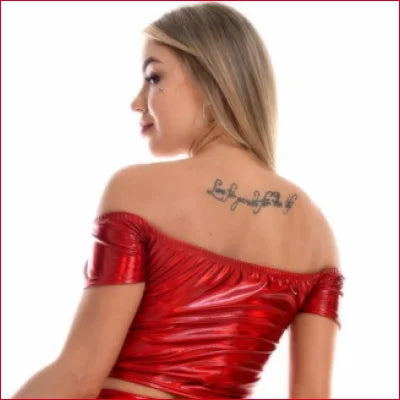 Woman in shiny red Disco Crop Off Shoulder Top showcasing tattoo for party wear