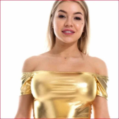 Woman in shiny gold Disco Crop Off Shoulder Top, perfect for party wear