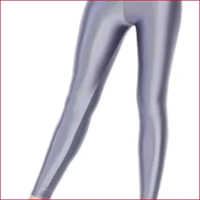 Shiny silver-gray Disco Quality Liquid Leggings showcased on stylish legs