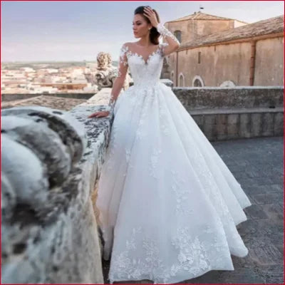 Elegant white wedding gown with lace details and a full skirt for your ivory wedding