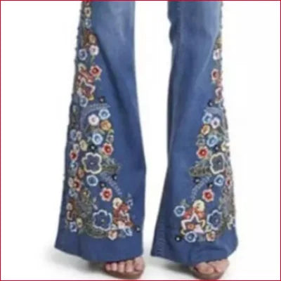 Flared Flowers Bell Bottom Women’s Jeans featuring colorful floral embroidery on legs