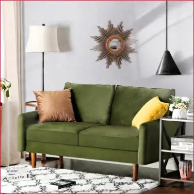 Green velvet loveseat from Everly Quinn Hessville Sofa with round arms for stylish decor