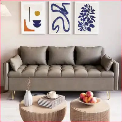 Tufted gray sofa with pillows in a modern design leather love seat with lift-up storage box