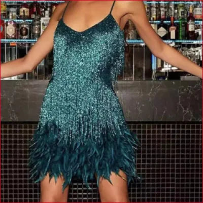 Sparkly teal Roaring 20s inspired women’s dress with a feathered skirt