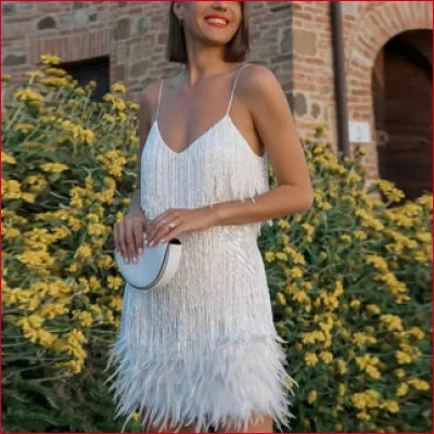 White fringed mini dress with spaghetti straps in Roaring 20s inspired women’s fashion