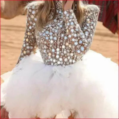 Sparkly white bridal gown with embellished bodice and tulle skirt for a fetish wedding