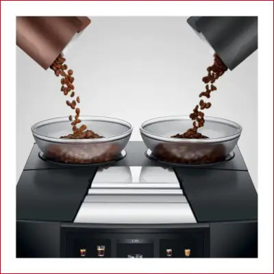 Coffee beans poured into bowls on the GIGA 10 Automatic Coffee Machine in Diamond Black