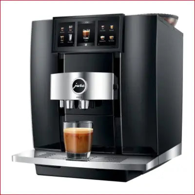 Black and silver GIGA 10 Automatic Coffee Machine with a glass of coffee