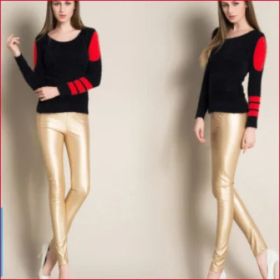 Two women in black tops and gold high waisted leather leggings for a luxe look