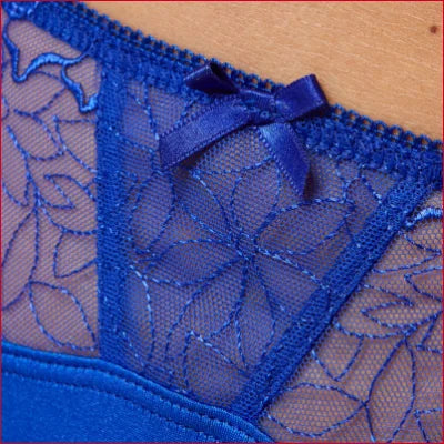 Blue lace thong panty with floral pattern and bow accent from Gorteks