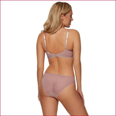 Woman in pale pink Gossard Glossies Lace sheer mesh bra, viewed from behind