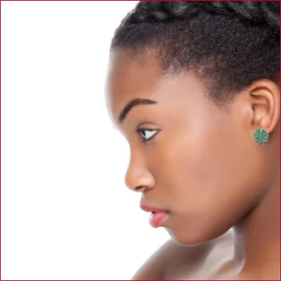 Profile view of a woman wearing Sterling Silver green leaf stud earrings