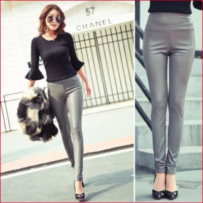 Woman in grey high waist leather leggings and a black flared sleeve top