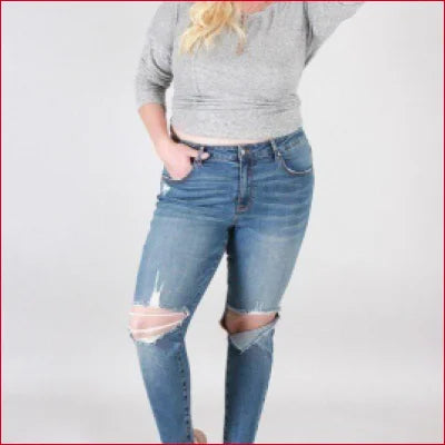 Super Stretchy Skinny Jeans with destroyed knee details in distressed blue denim