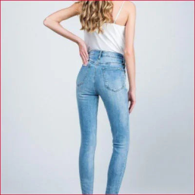 Light blue skinny jeans featuring a crotch zipper and medium-light wash for a stylish look