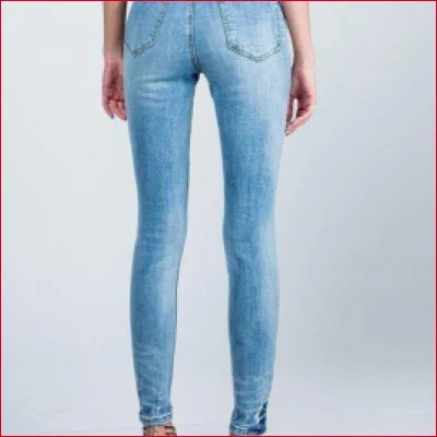 Light blue skinny jeans with bleached effect and crotch zipper for a stylish look