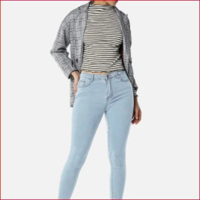 Light blue high rise slim fit jeans paired with a striped top and gray jacket