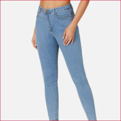 Light blue high rise slim fit jeans worn on a woman for a stylish look