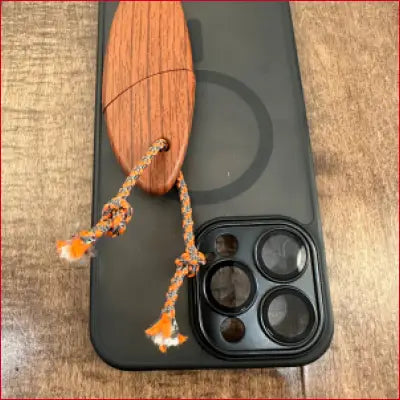 Smartphone with wooden charm in iPhone 14 Plus Black Case Box Letter Opener