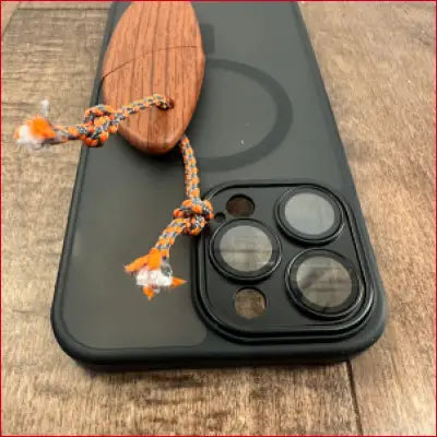 Black phone case with wooden grip, perfect for iPhone 14 Plus box letter opener use