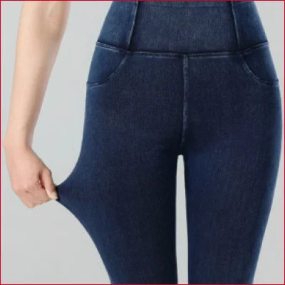 Dark blue jeggings jean leggings styled on a person for a trendy look