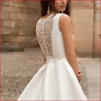 Elegant white wedding dress with lace back detailing and crotch zipper for comfort