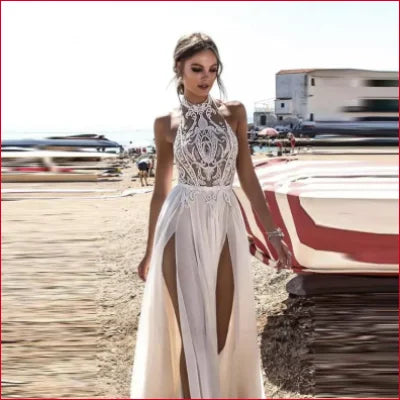 Elegant white lace halter backless bridal gown with high slits for a stunning wedding look