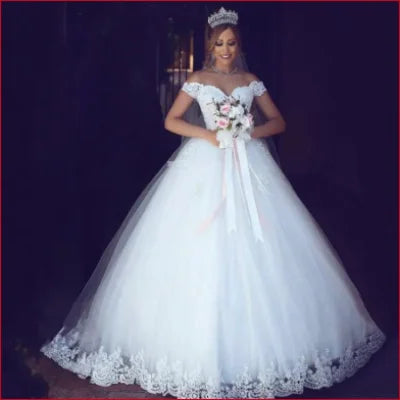 Ornate white shoulder wedding dress with lace trim, tulle skirt for a princess look