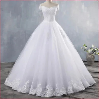 Elegant shoulder wedding dress with lace-trimmed full skirt for a princess bridal look