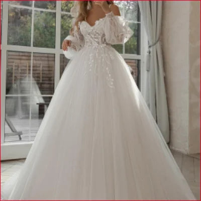 Elegant white bridal gown with gorgeous lace and voluminous tulle skirt, featuring a crotch zipper