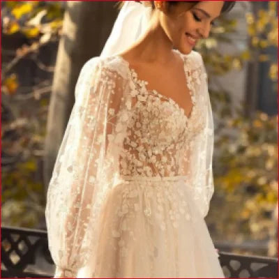 Elegant Lace Sleeves Bridal Gown featuring a lace bodice and flowing sleeves