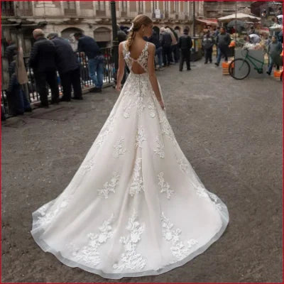 Elegant Sleeveless Backless Lace Wedding Dress with Intricate Details in White, Ivory, Champagne