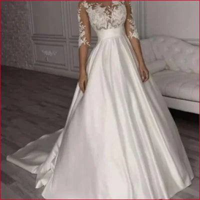 Elegant Lace Wedding Dress Bridal Gown featuring lace sleeves and a flowing skirt