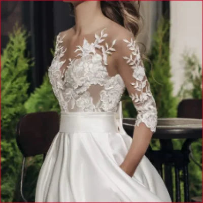 Elegant Lace Wedding Dress with lace bodice and three-quarter sleeves for bridal gowns