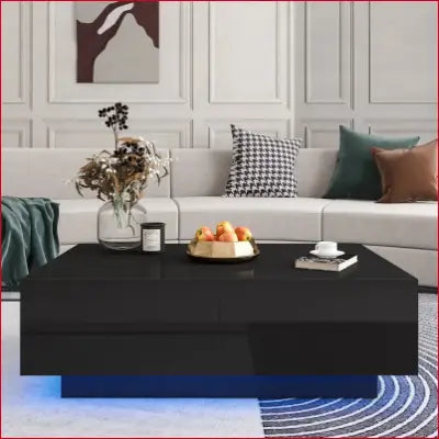 Black glossy LED coffee table with blue lighting and modern center drawers for living room