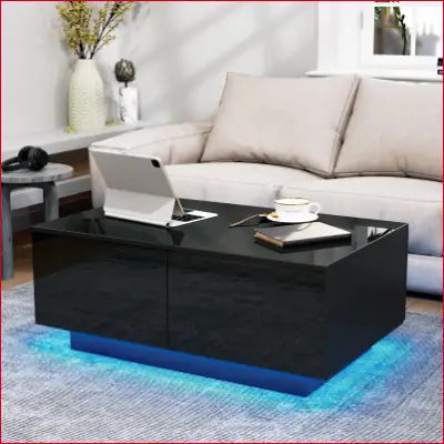 Black glossy LED coffee table with blue lighting and modern center drawers