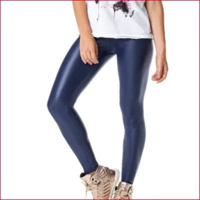 Navy blue shiny leggings with crotch zipper paired with beige sneakers for gym or club wear